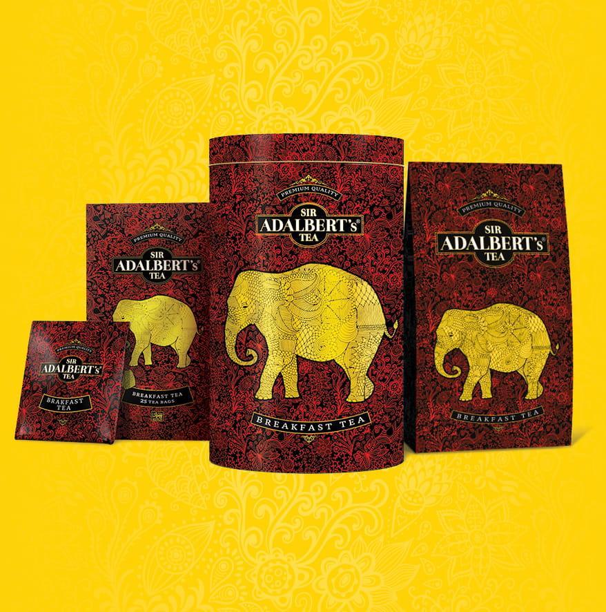 Opakowania Sir Adalbert's Tea Breakfast Tea z żółtym słoniem na czerwonym tle, żółte tło