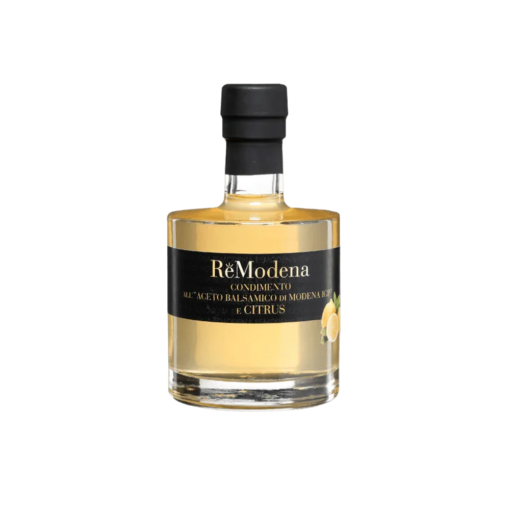 Butelka ocetu balsamicznego ReModena z Modeny o smaku cytrusowym, etykieta czarna z żółtym napisem